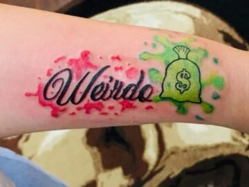 Attractive-Behind-The-Ear-Money-Bag-Tattoo-11